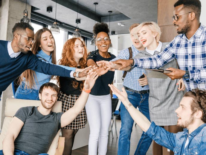 Image showing a group of people laying hands one on other