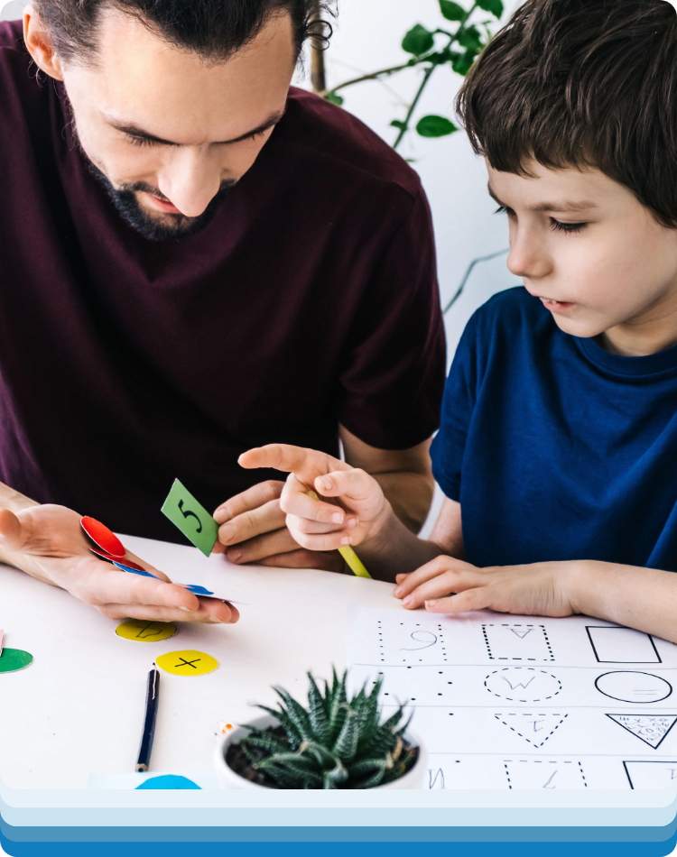 child and dad at behavioral therapy for adhd