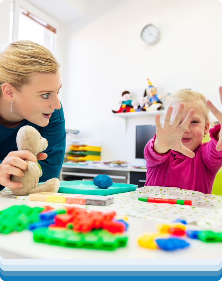 Therapist and small child busy with therapy for kids near me